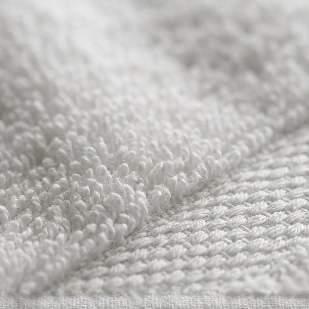 Close-up of white terry cotton loop pile and dobby border